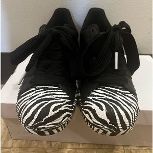 Black adidas superstar (shelltoes) with zebra print.